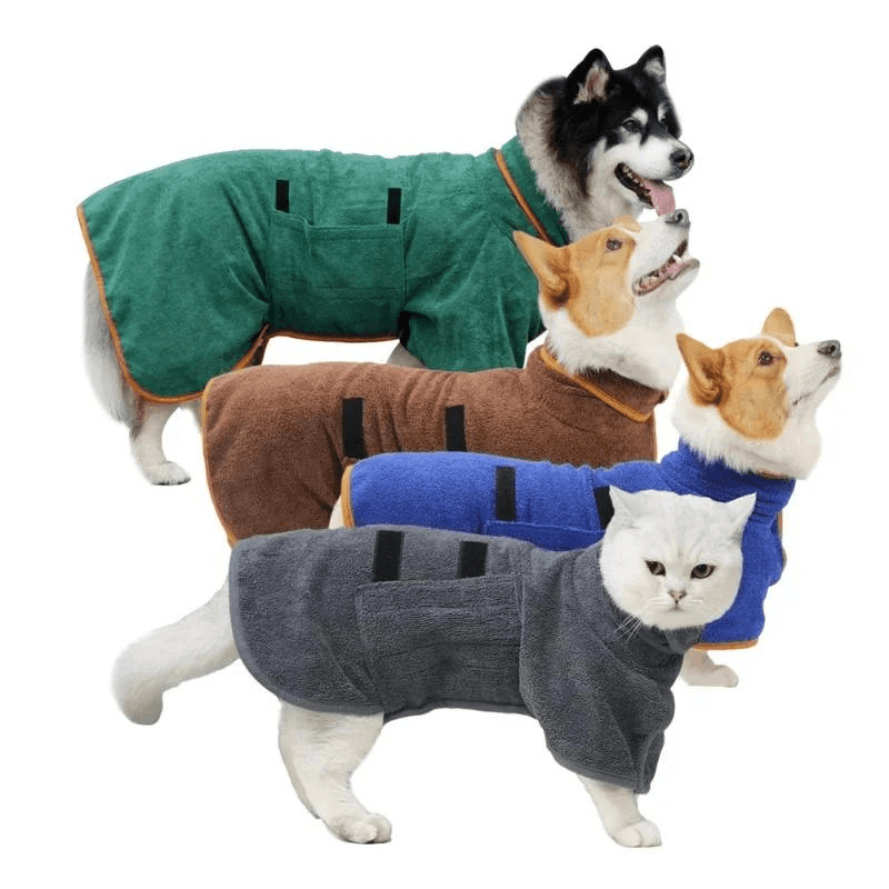 three different sizes and breed of dogs and one cat wearing the dog Bathrobe in the four colors available